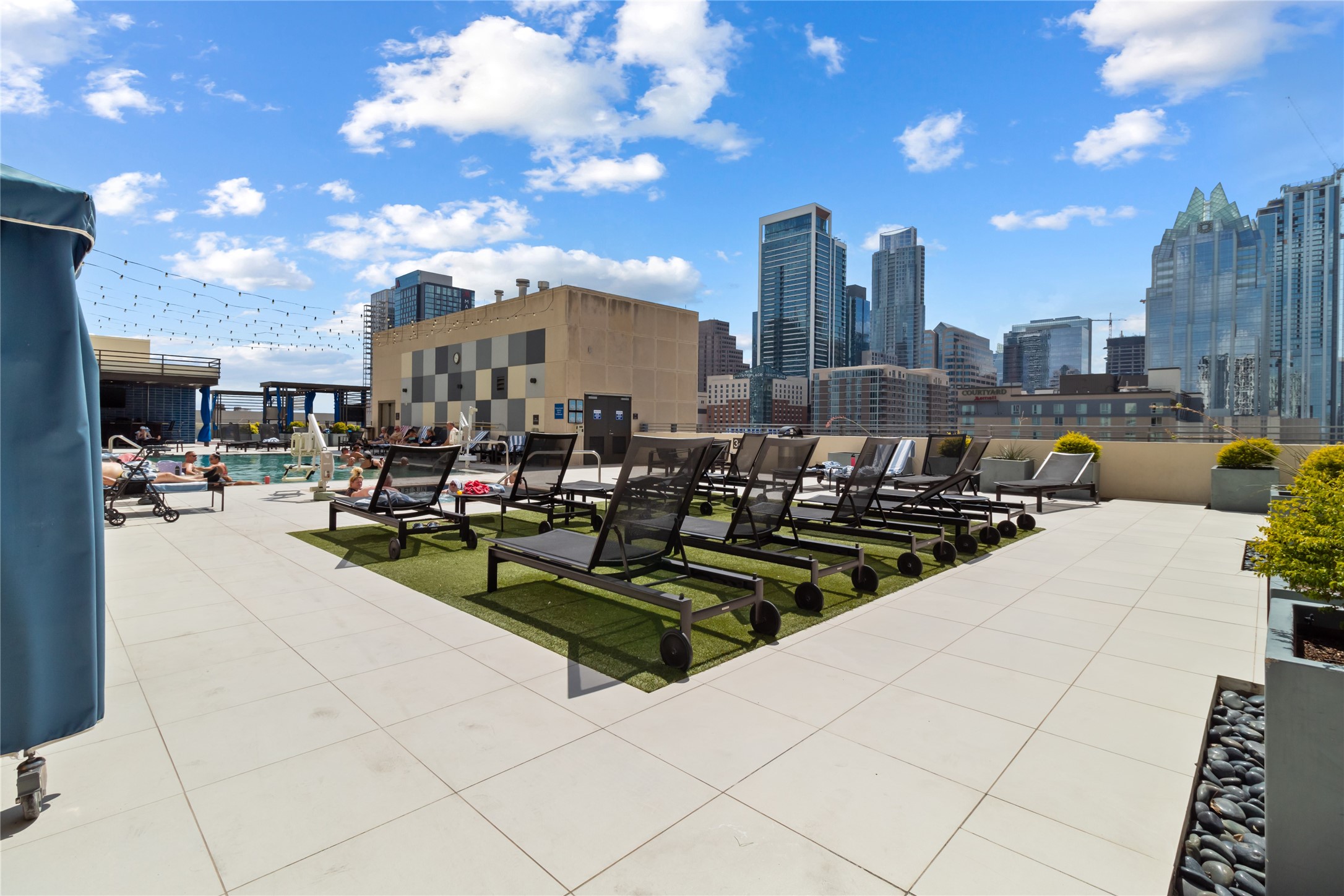 555 East 5th Street, Unit 521 Austin, TX 78701 - Photo 35 of 37 a view of a patio with couches and a fire pit
