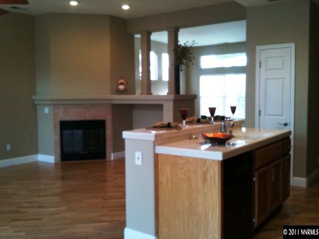 9570 Oakley Lane Reno, NV 89521 - Photo 3 of 5 a kitchen with a sink and a mirror