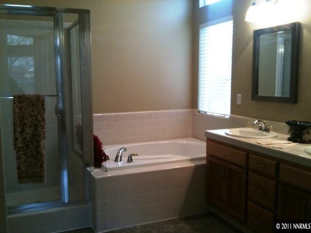 9570 Oakley Lane Reno, NV 89521 - Photo 5 of 5 a bathroom with a bathtub and a sink