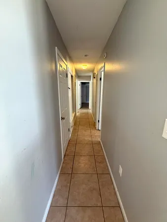 a view of a hallway with a white walls