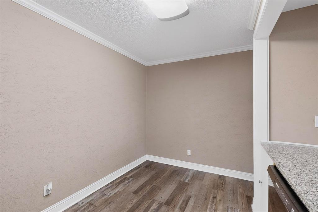 2200 East Trinity Mills Road, Unit 616 Carrollton, TX 75006 - Photo 11 of 34 a view of an empty room with wooden floor