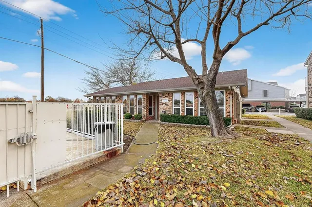 a view of a building with a yard