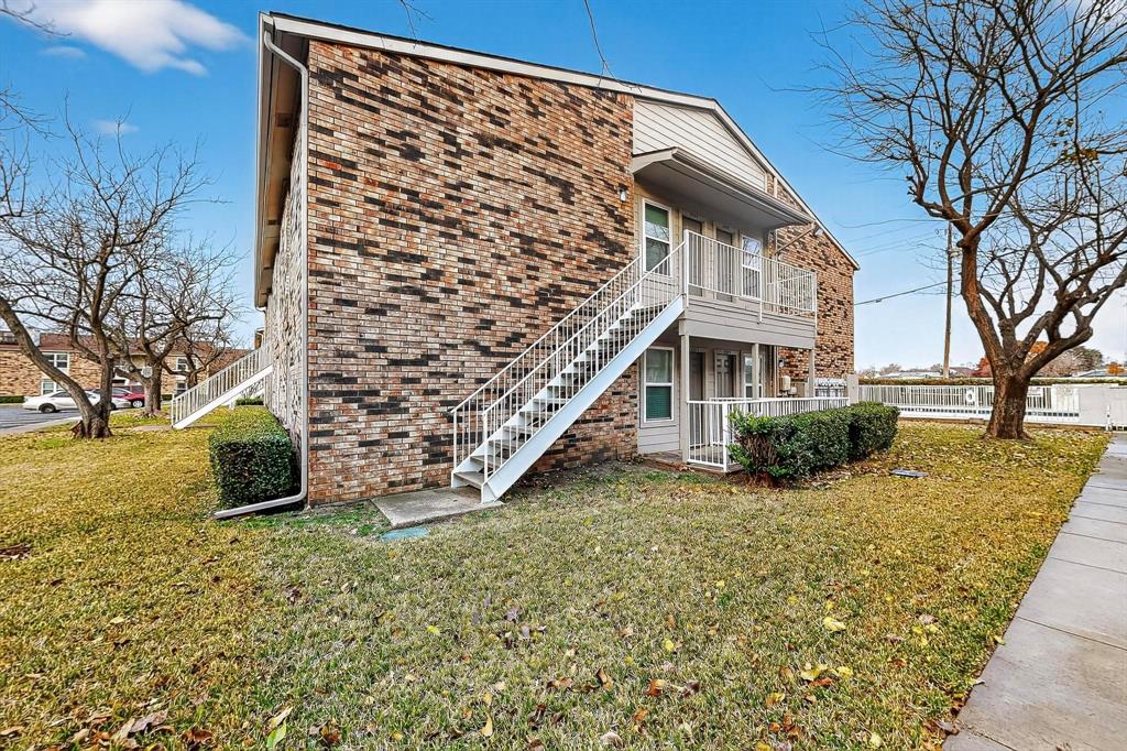 2200 East Trinity Mills Road, Unit 616 Carrollton, TX 75006 - Photo 34 of 34 a view of a house with a yard