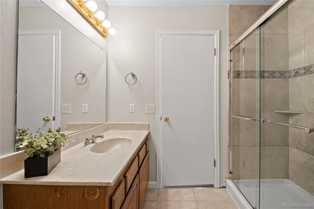 a bathroom with a sink and a shower