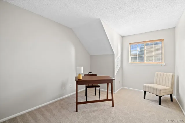 a room with furniture and a window