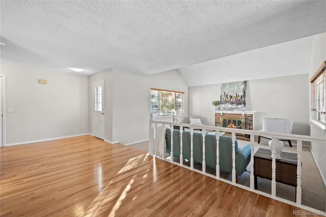 a view of a living room with wooden floor