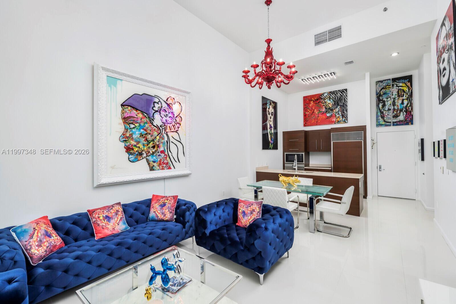 475 Brickell Avenue, Unit 2811 Miami, FL 33131 - Photo 5 of 14 a living room with furniture and a chandelier