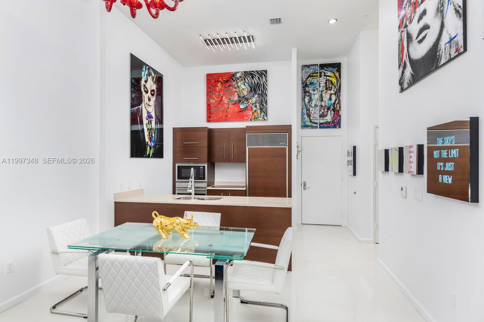 475 Brickell Avenue, Unit 2811 Miami, FL 33131 - Photo 6 of 14 a living room with furniture and flat screen tv