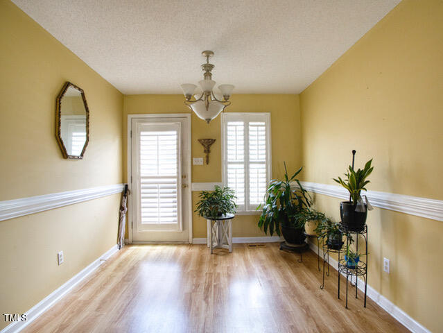 2817 Buckboard Lane Raleigh, NC 27603 - Photo 11 of 31 a view of a living room and a potted plant