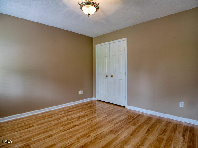 2817 Buckboard Lane Raleigh, NC 27603 - Photo 21 of 31 a view of empty room with wooden floor