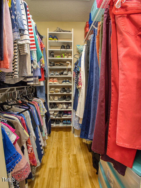 2817 Buckboard Lane Raleigh, NC 27603 - Photo 30 of 31 a view of walk in closet with clothes and shoes