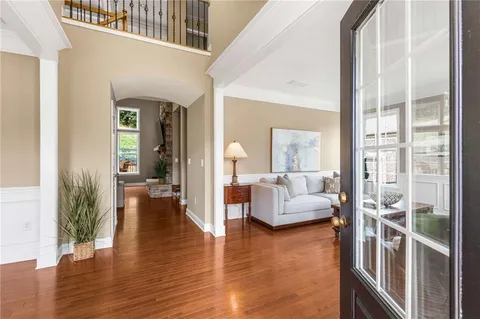 a view of a dining room with furniture window and wooden floor