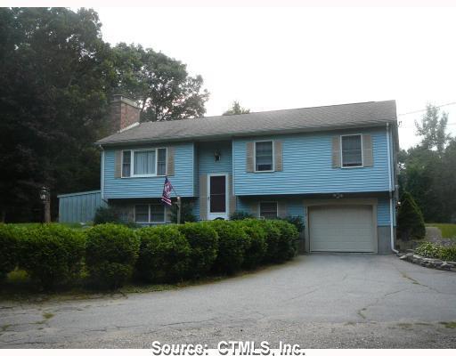 819 Cook Hill Road Killingly, CT 06239 - Photo 1 of 1 a front view of a house with a garden