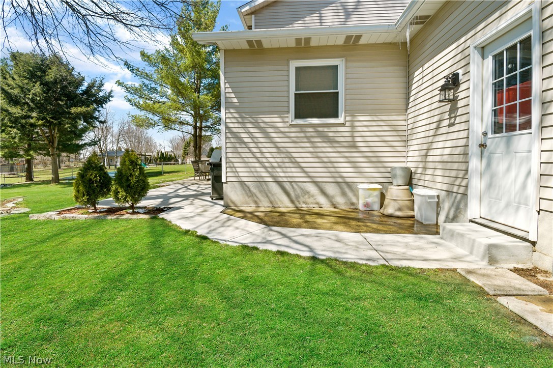 828 Bridge Road Akron, OH 44312 - Photo 27 of 35 Side Walkway Leading to Beautiful Backyard Area