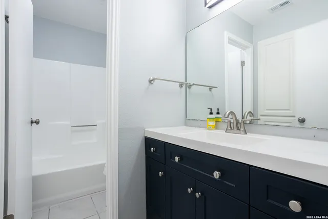 a white toilet sitting next to a bath tub shower