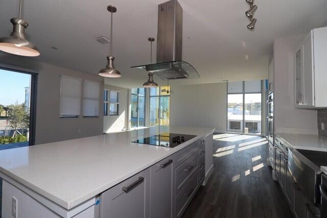 8653 Ivanhoe Drive Melbourne, FL 32940 - Photo 14 of 24 a kitchen with stainless steel appliances granite countertop a sink a stove and a refrigerator