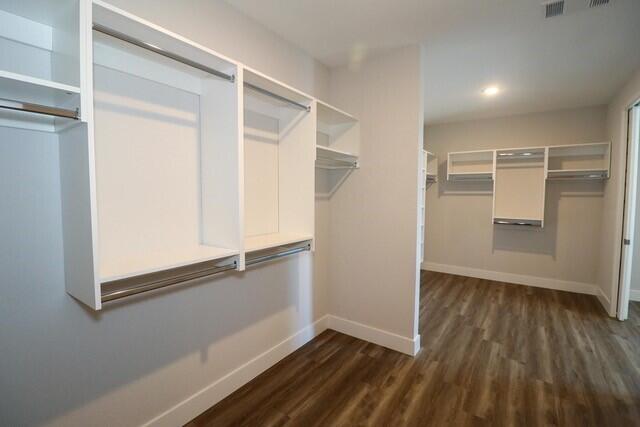 8653 Ivanhoe Drive Melbourne, FL 32940 - Photo 17 of 24 a view of an empty room with wooden floor and closet