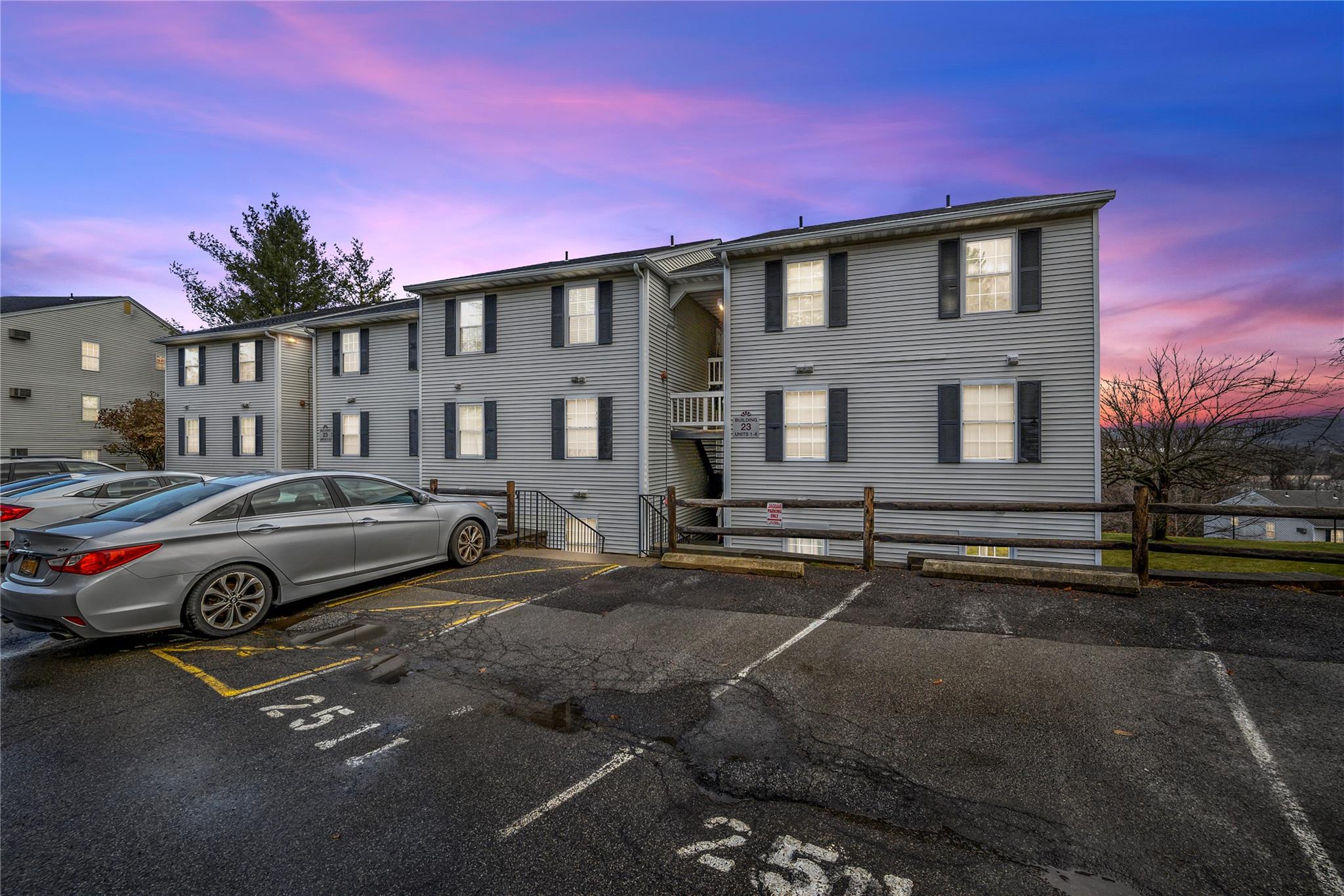 23 Lexington Hills Road, Unit 6 Harriman, NY 10926 - Photo 1 of 1 View of front facade featuring fence and uncovered parking