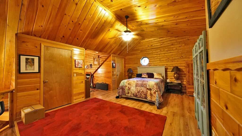 97 South Oakfield Road Linneus, ME 04730 - Photo 51 of 78 cathedral-log-loft-bedroom