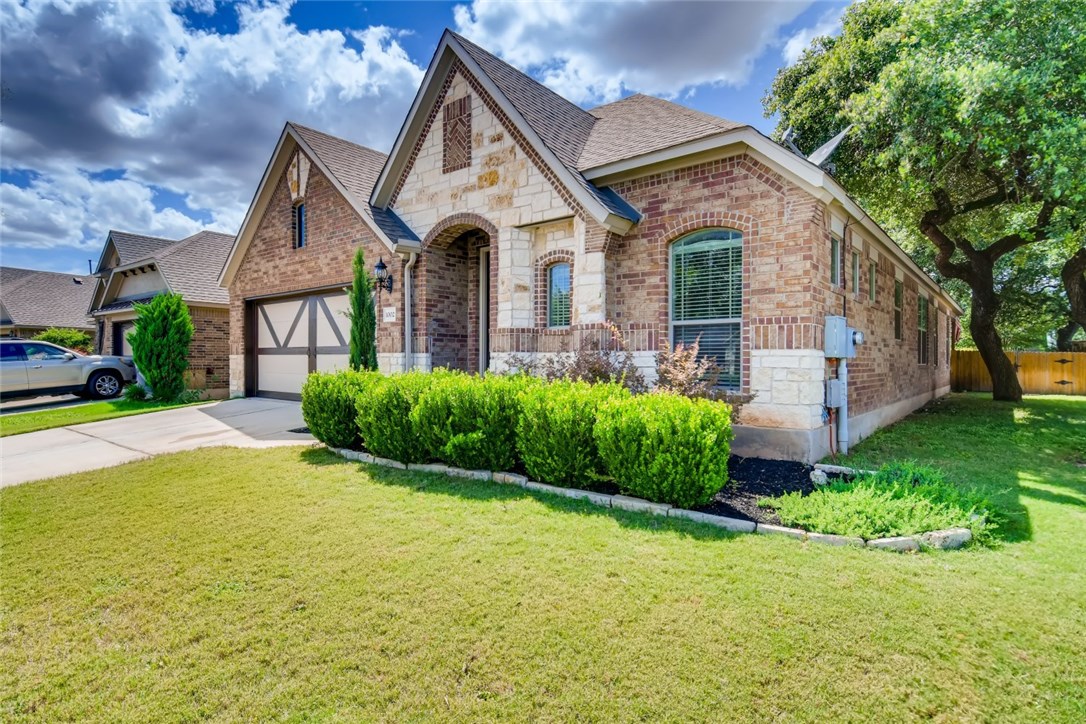 1002 Boxwood Loop Georgetown, TX 78628 - Photo 1 of 1 a front view of a house with a yard