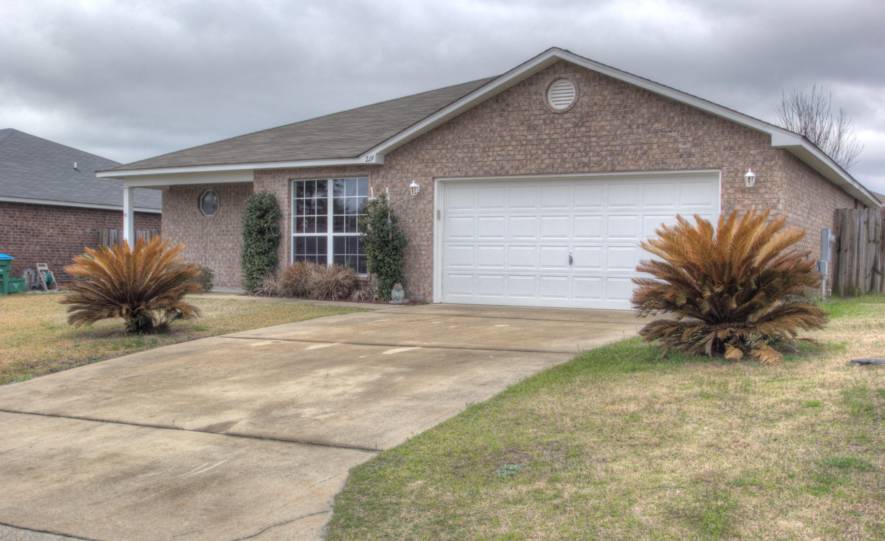 219 Limestone Circle Crestview, FL 32539 - Photo 1 of 31 a view of a house with a yard and potted plants