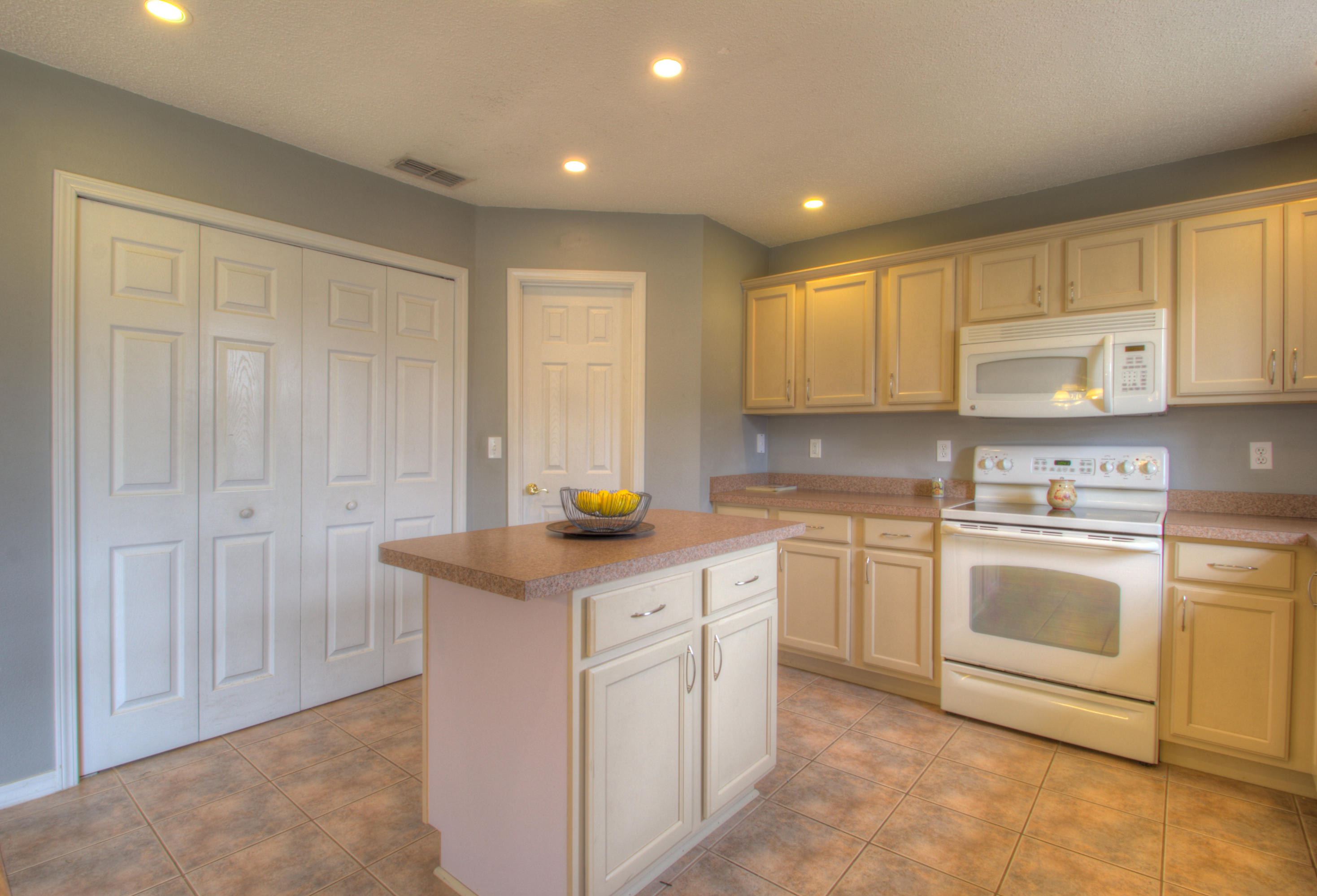 219 Limestone Circle Crestview, FL 32539 - Photo 12 of 31 a kitchen with white cabinets and sink