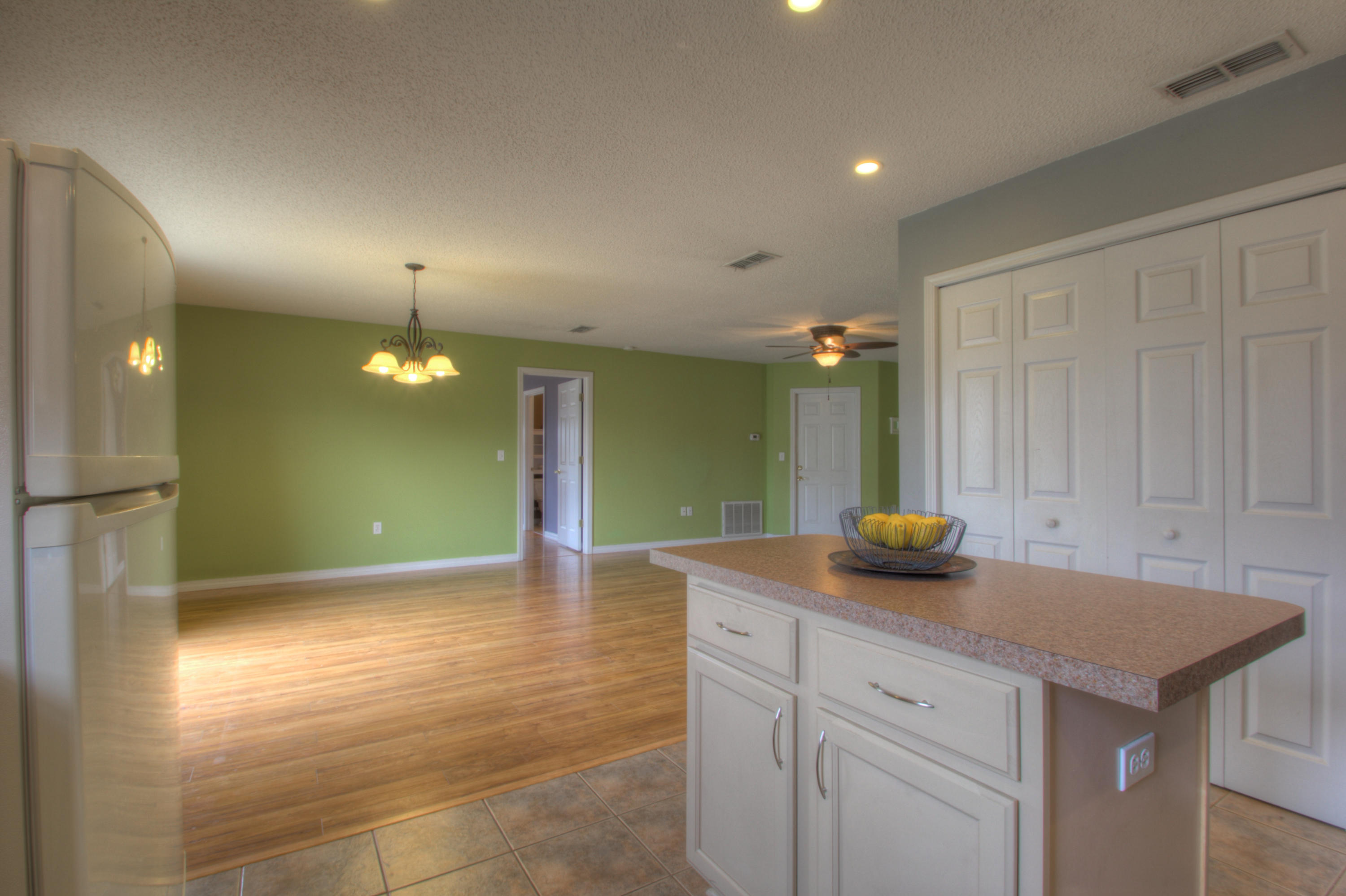 219 Limestone Circle Crestview, FL 32539 - Photo 14 of 31 a view of an empty room and kitchen view