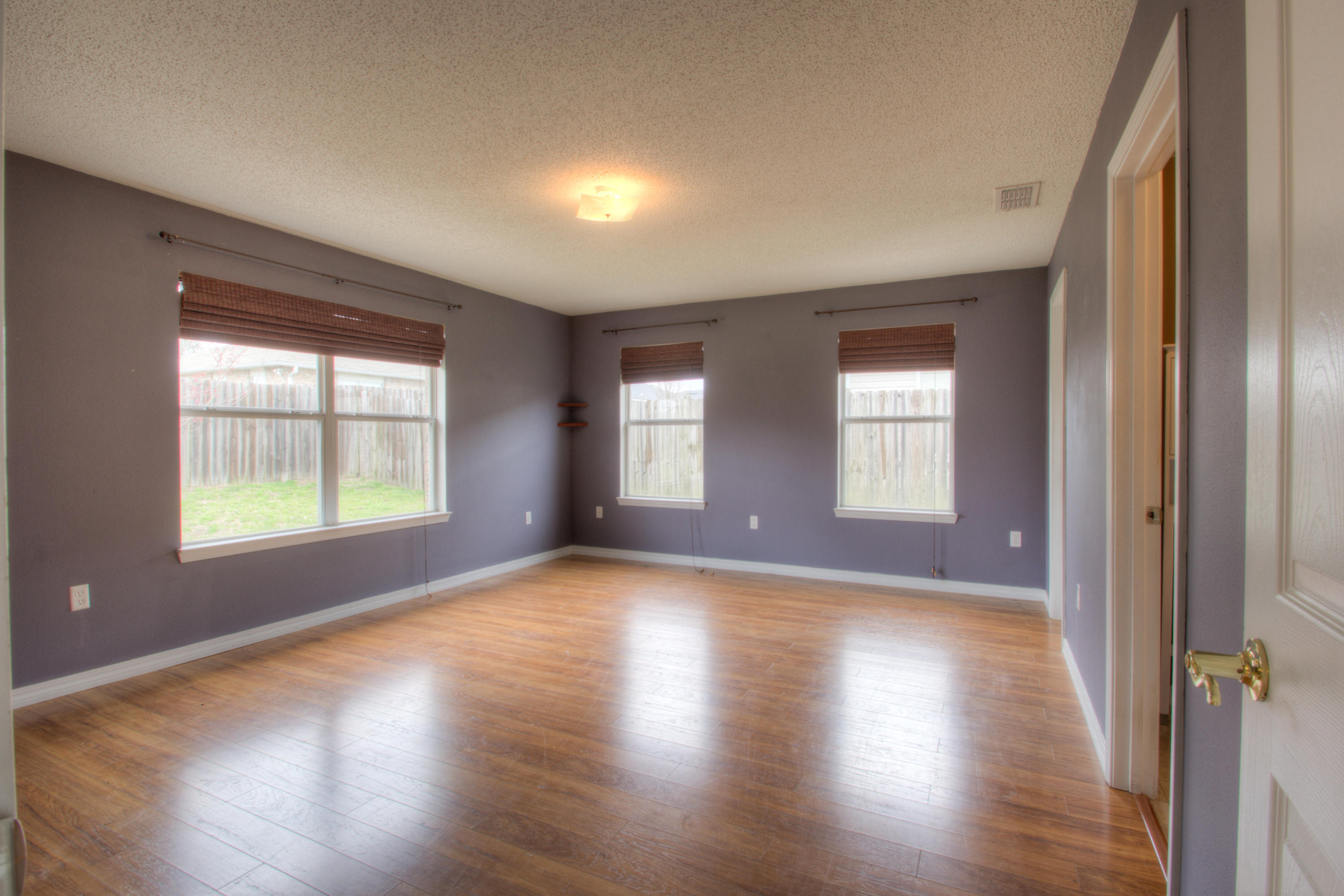 219 Limestone Circle Crestview, FL 32539 - Photo 15 of 31 a view of an empty room with wooden floor and a window