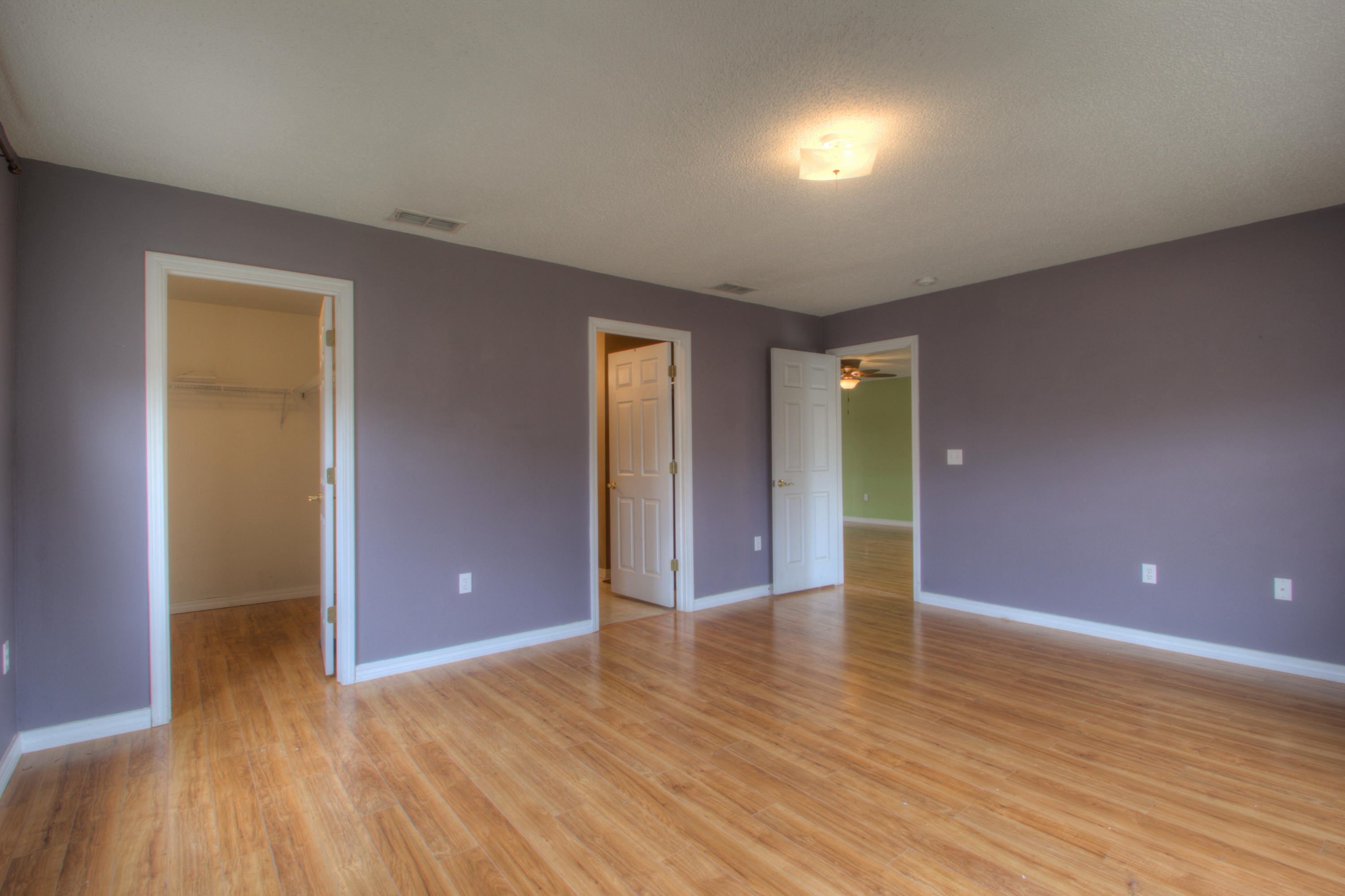 219 Limestone Circle Crestview, FL 32539 - Photo 16 of 31 a view of an empty room with wooden floor and closet
