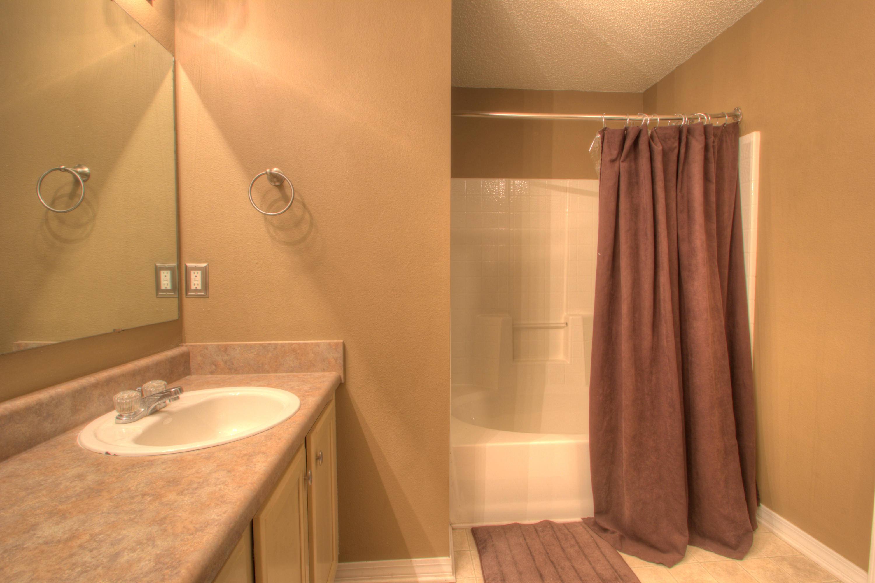 219 Limestone Circle Crestview, FL 32539 - Photo 20 of 31 a bathroom with a sink and a mirror