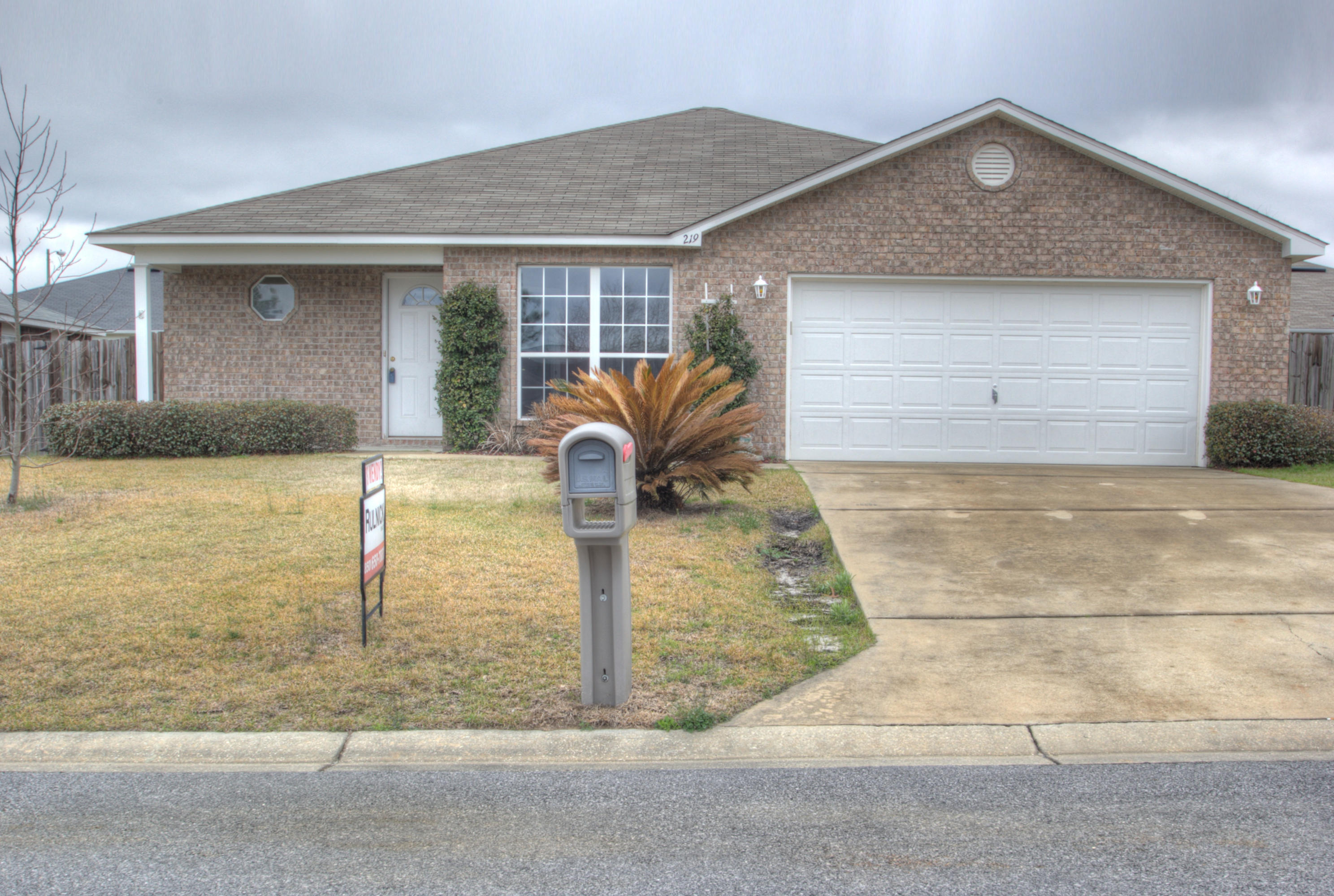 219 Limestone Circle Crestview, FL 32539 - Photo 2 of 31 a front view of a house with garden