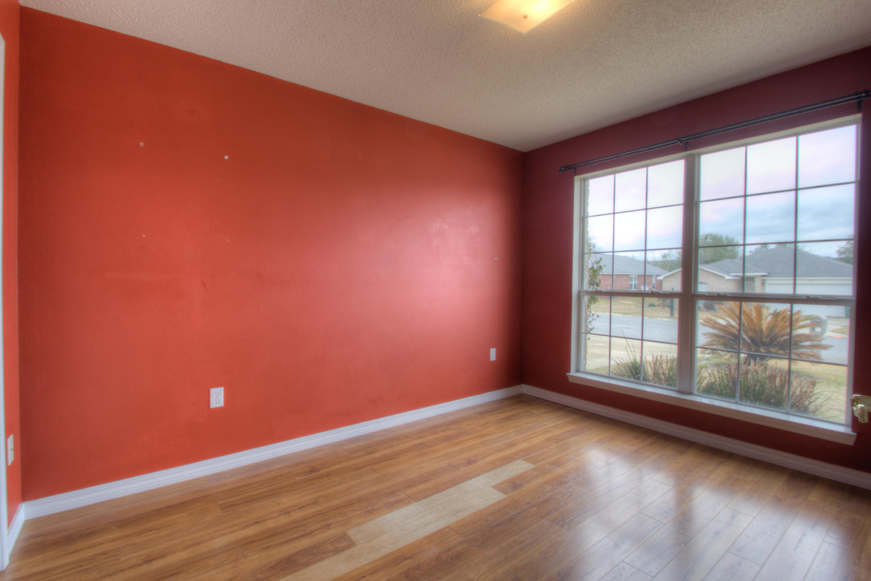 219 Limestone Circle Crestview, FL 32539 - Photo 21 of 31 a view of empty room with wooden floor and fan