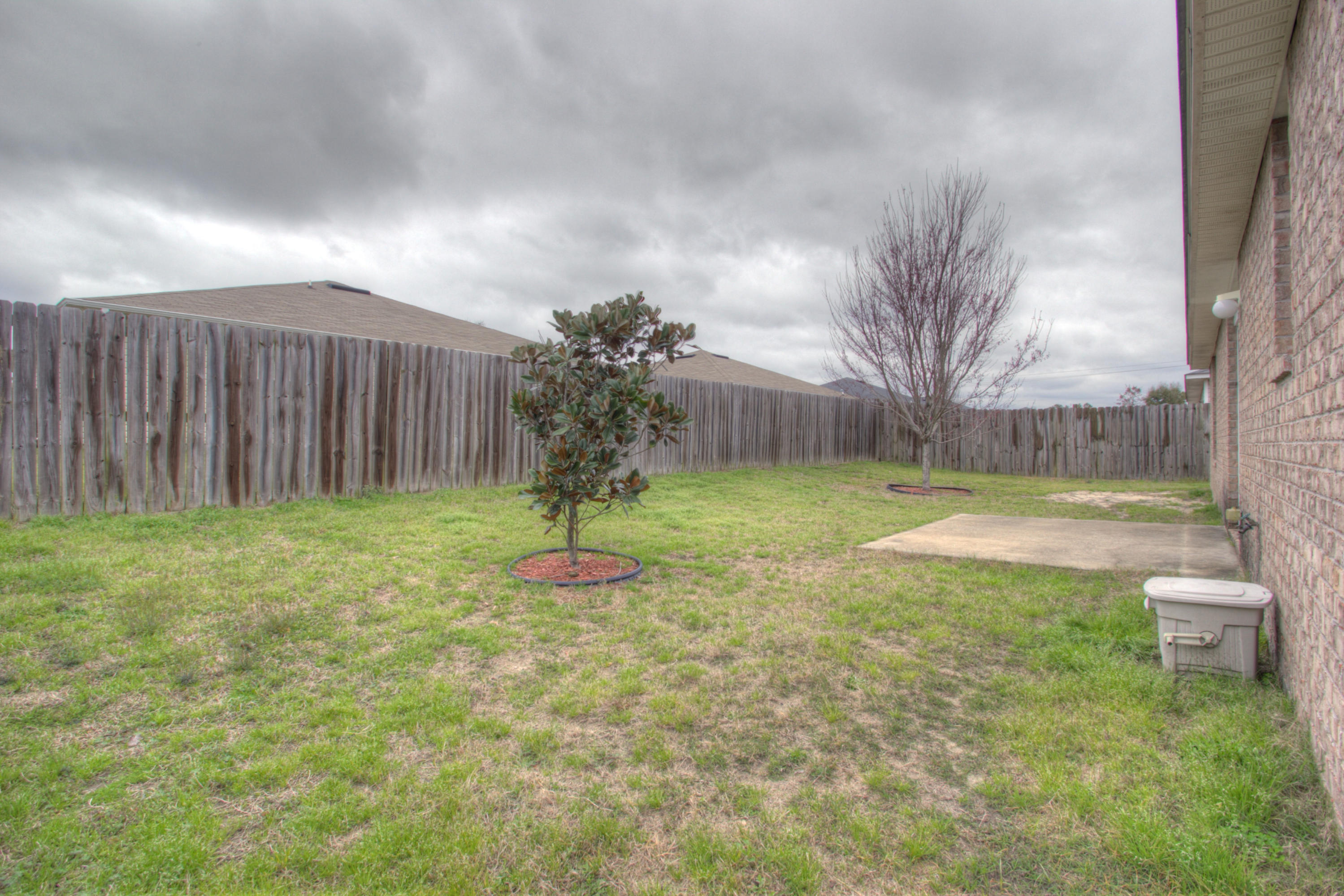 219 Limestone Circle Crestview, FL 32539 - Photo 27 of 31 a view of a backyard with a garden