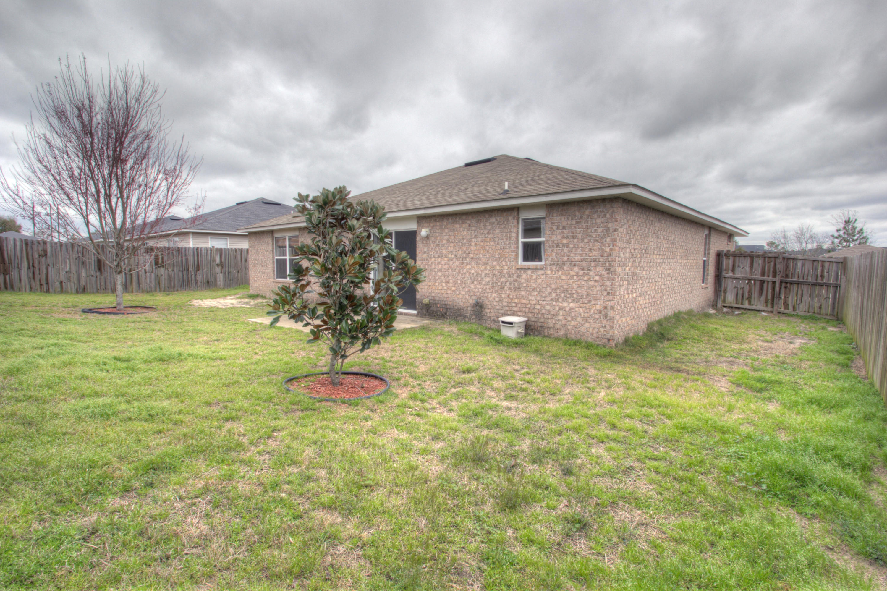 219 Limestone Circle Crestview, FL 32539 - Photo 28 of 31 a front view of a house with a yard