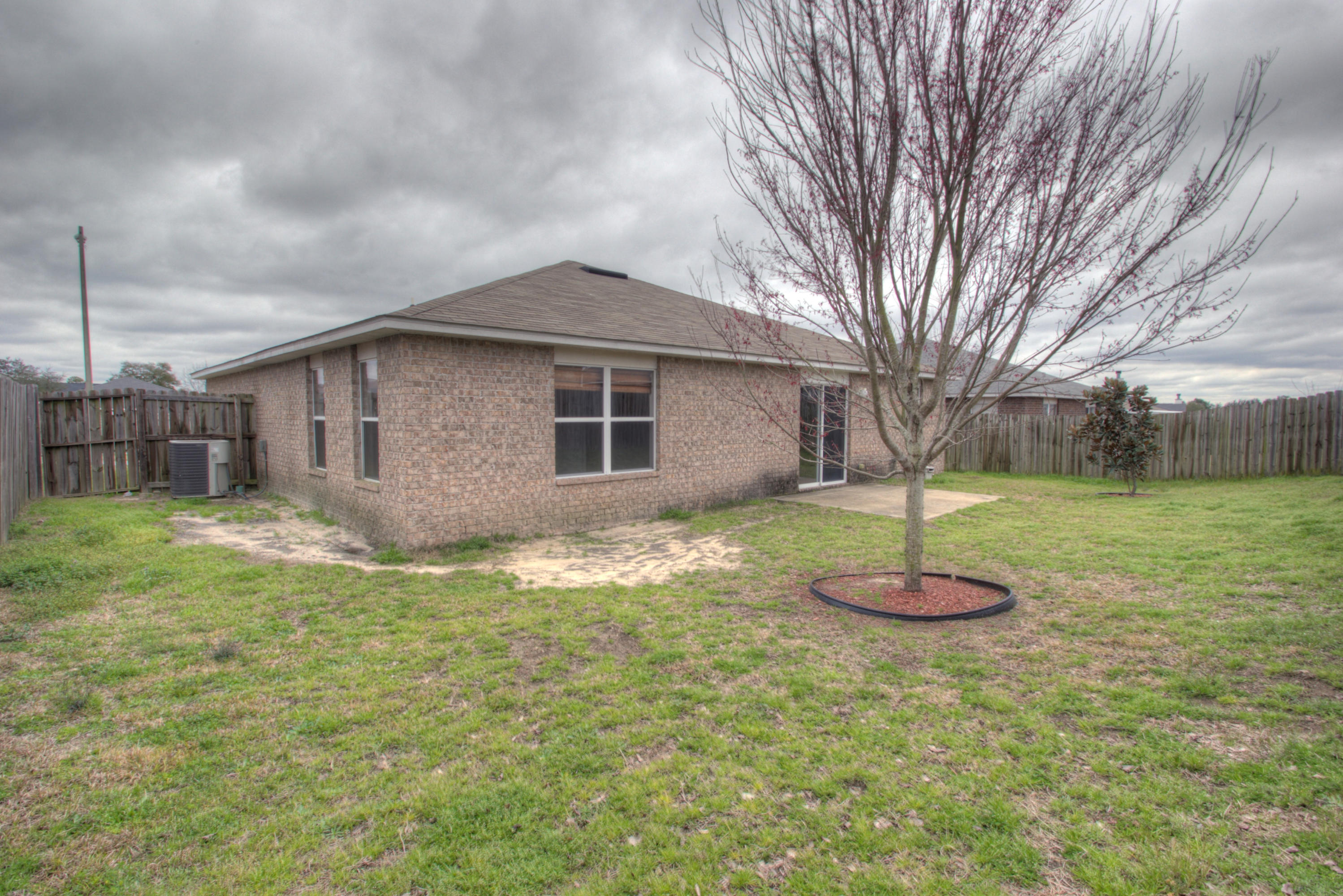 219 Limestone Circle Crestview, FL 32539 - Photo 29 of 31 a front view of house with yard and tree