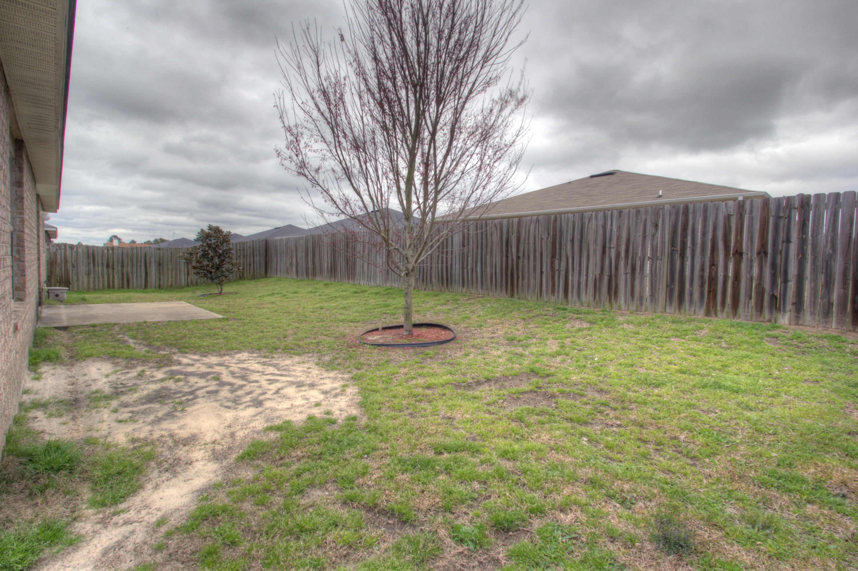 219 Limestone Circle Crestview, FL 32539 - Photo 30 of 31 a view of outdoor space with playground and green space