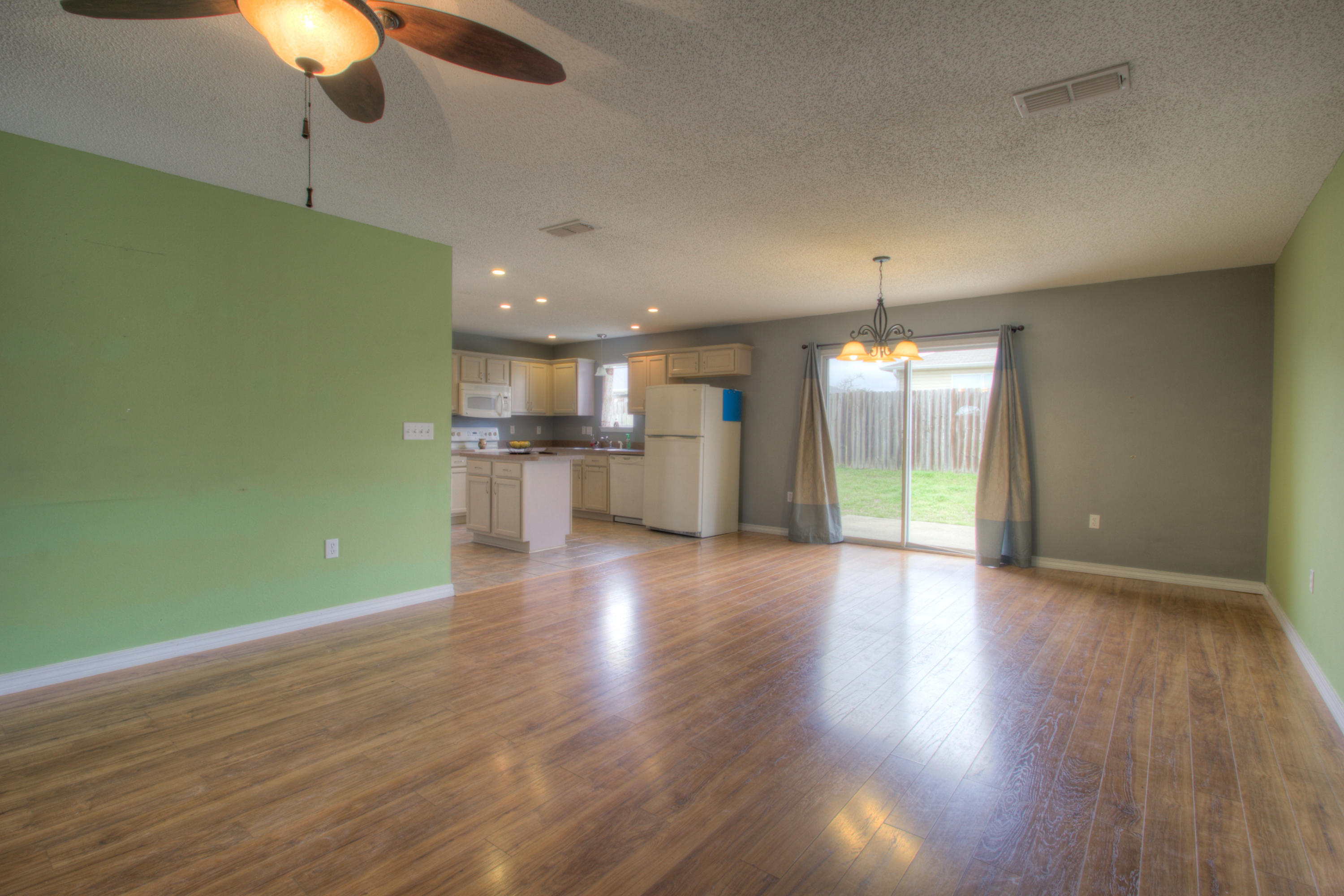 219 Limestone Circle Crestview, FL 32539 - Photo 4 of 31 a view of a room with a kitchen wooden floor and a kitchen