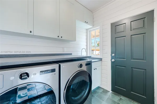 a utility room with dryer and washer