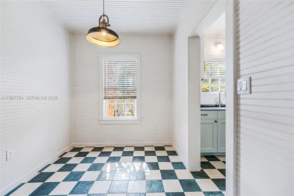 a black and white checkered floor with a black white checkered floor