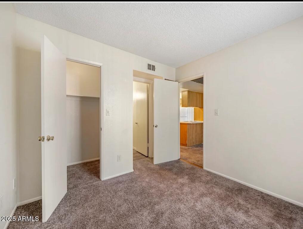 5750 North 59th Avenue, Unit 2 Glendale, AZ 85301 - Photo 4 of 12 a view of an empty room with an entryway