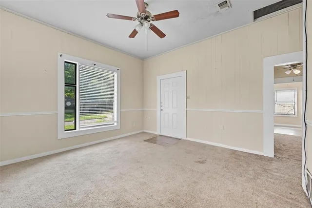 a view of an empty room with a window