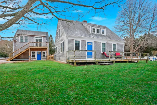 a front view of house with yard and green space