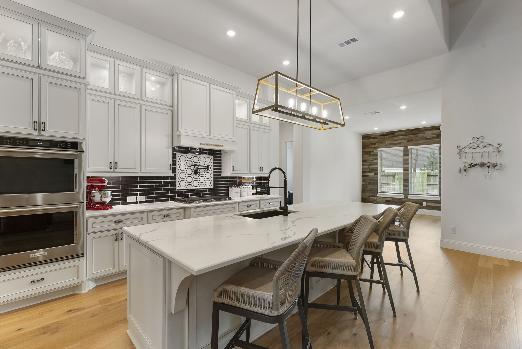 12932 Whitewater Way Conroe, TX 77302 - Photo 9 of 48 The designer kitchen showcases an expansive island with plenty of room for seating and serving.