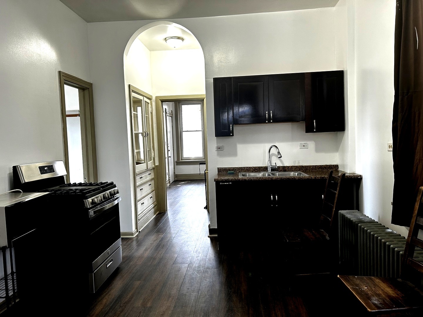 2744 West 23rd Street Chicago, IL 60608 - Photo 3 of 7 a view of living room with furniture and flat screen tv