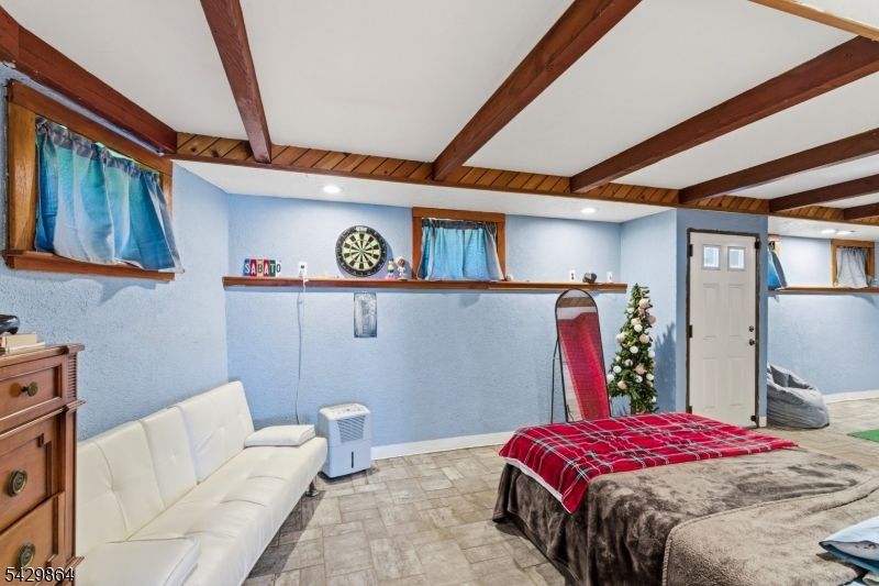 77 Lower North Shore Road Branchville, NJ 07826 - Photo 21 of 38 a bedroom with a bed and wooden floor