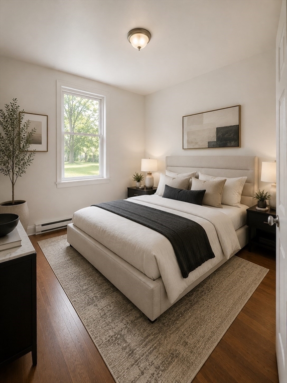 128 Shawmut Street, Unit 2 Chelsea, MA 02150 - Photo 6 of 12 a bedroom with a bed and a window