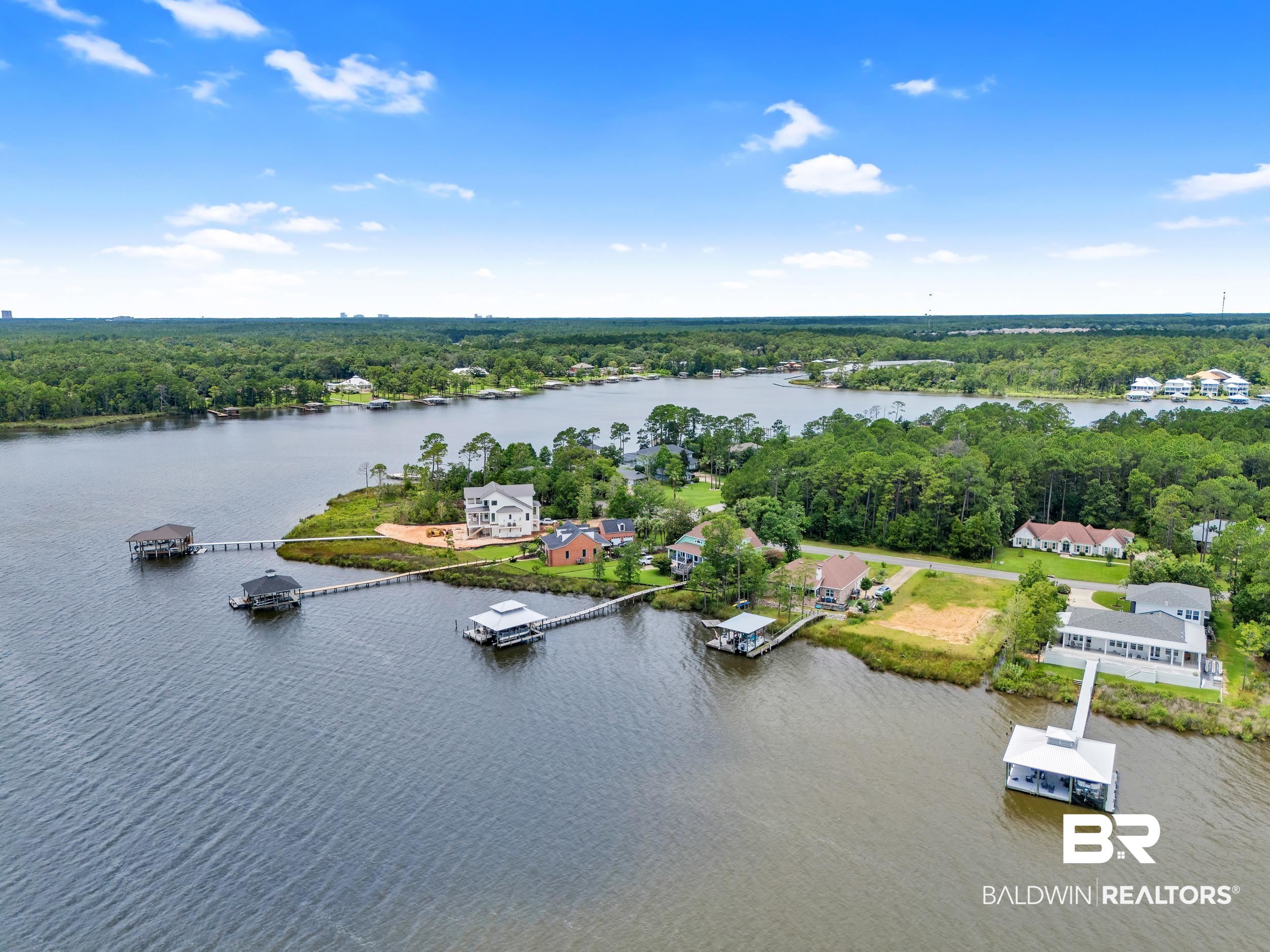 8963 Bay Point Drive Elberta, AL 36530 - Photo 18 of 25 Aerial view of a nearby body of water and a forest