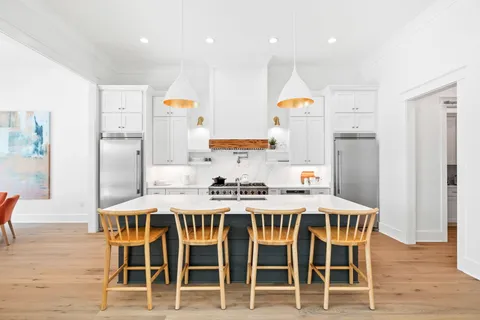 a kitchen with a sink and a stove top oven