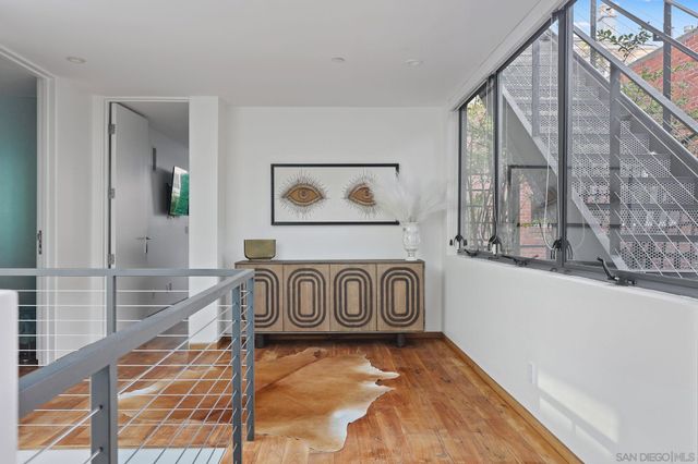 a view of an entryway with wooden floor