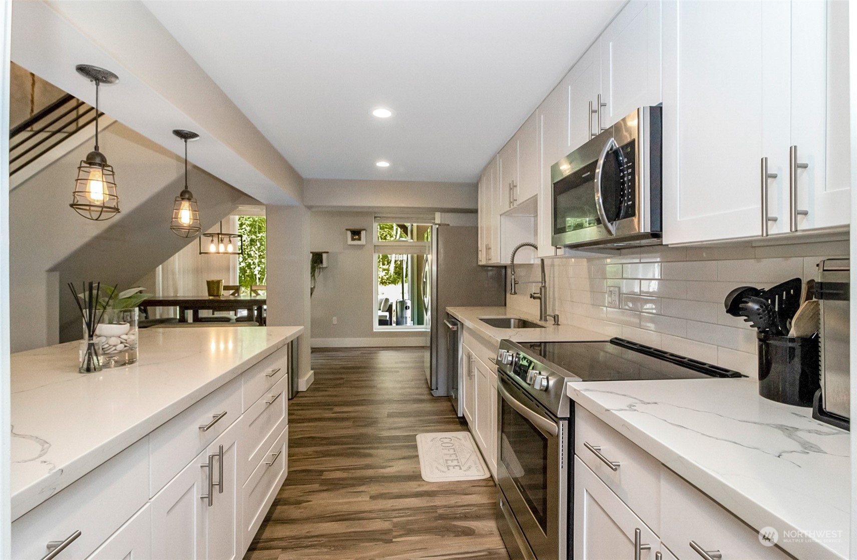 5124 Schwarzmiller Road Lake Stevens, WA 98258 - Photo 11 of 32 a kitchen with a sink stove and cabinets